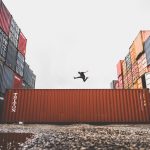 Man Jumping on Intermodal Container